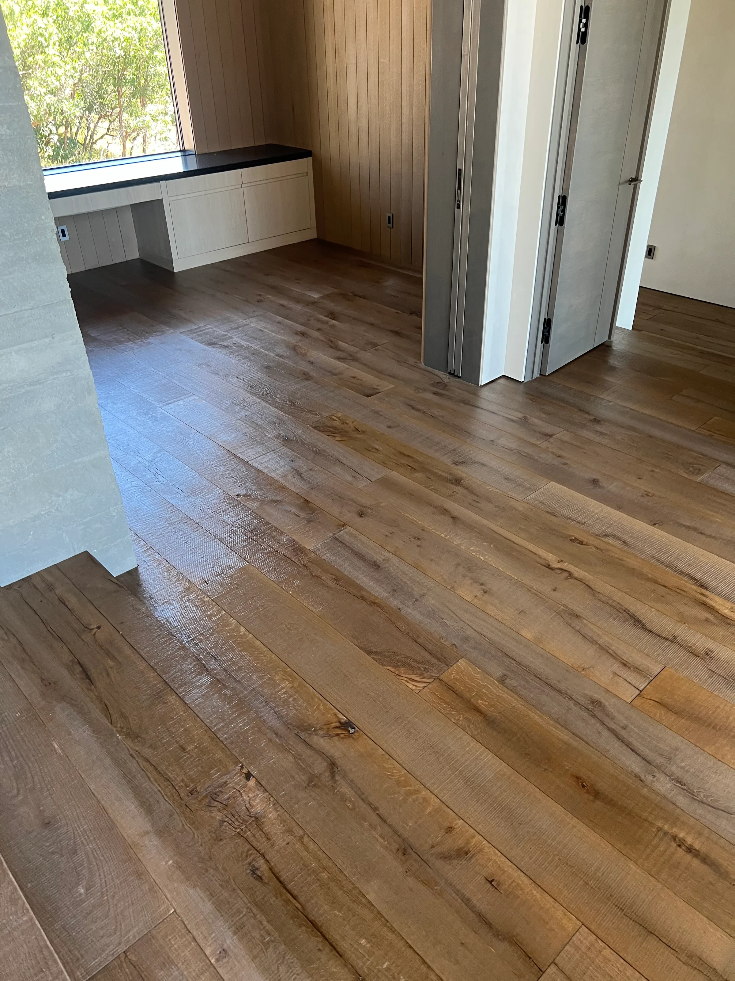Pre-finished white oak hardwood in residential interior with factory finish and natural grain visible