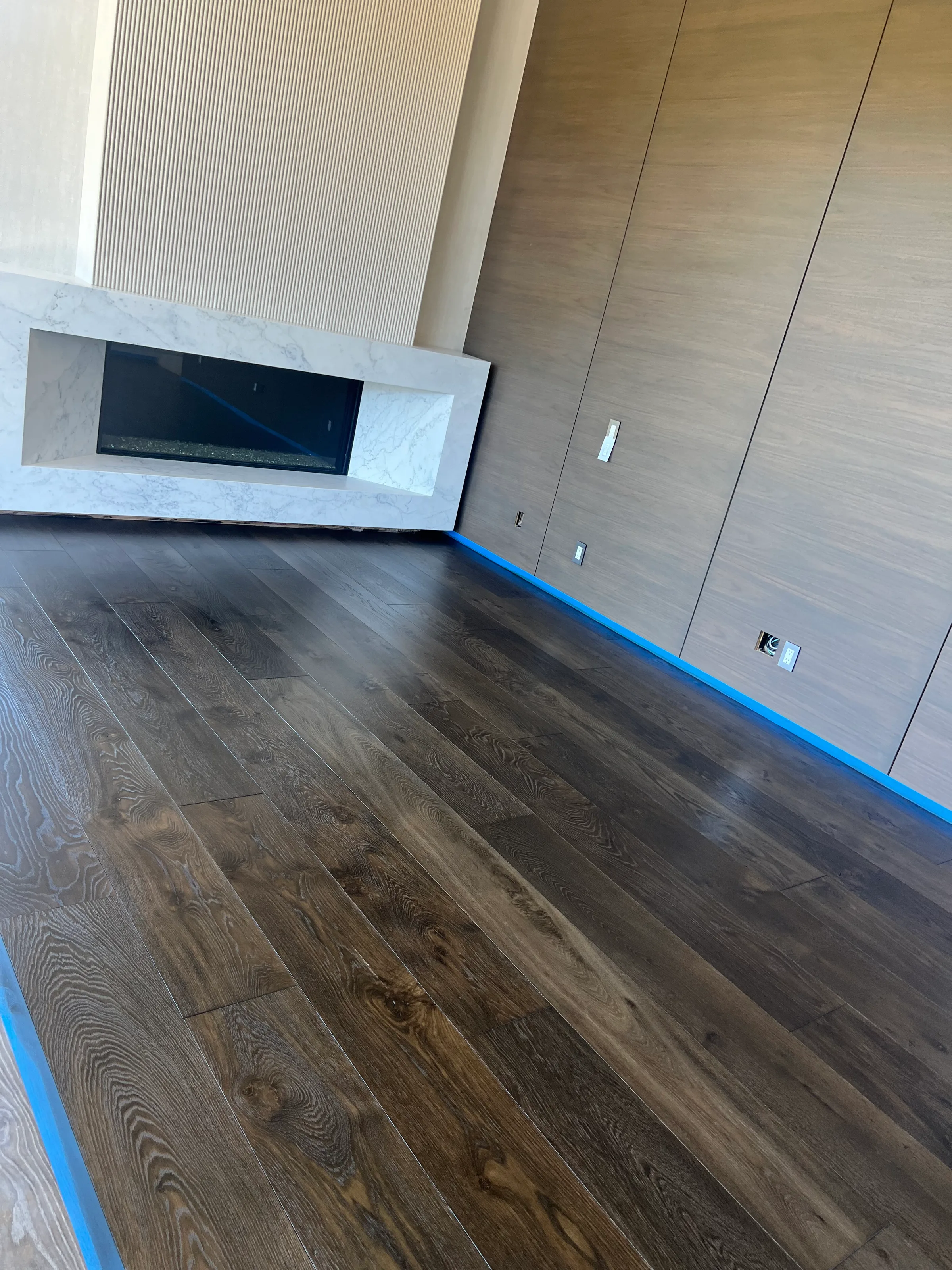 New pre-finished hardwood installation in contemporary residential space with minimalist aesthetic