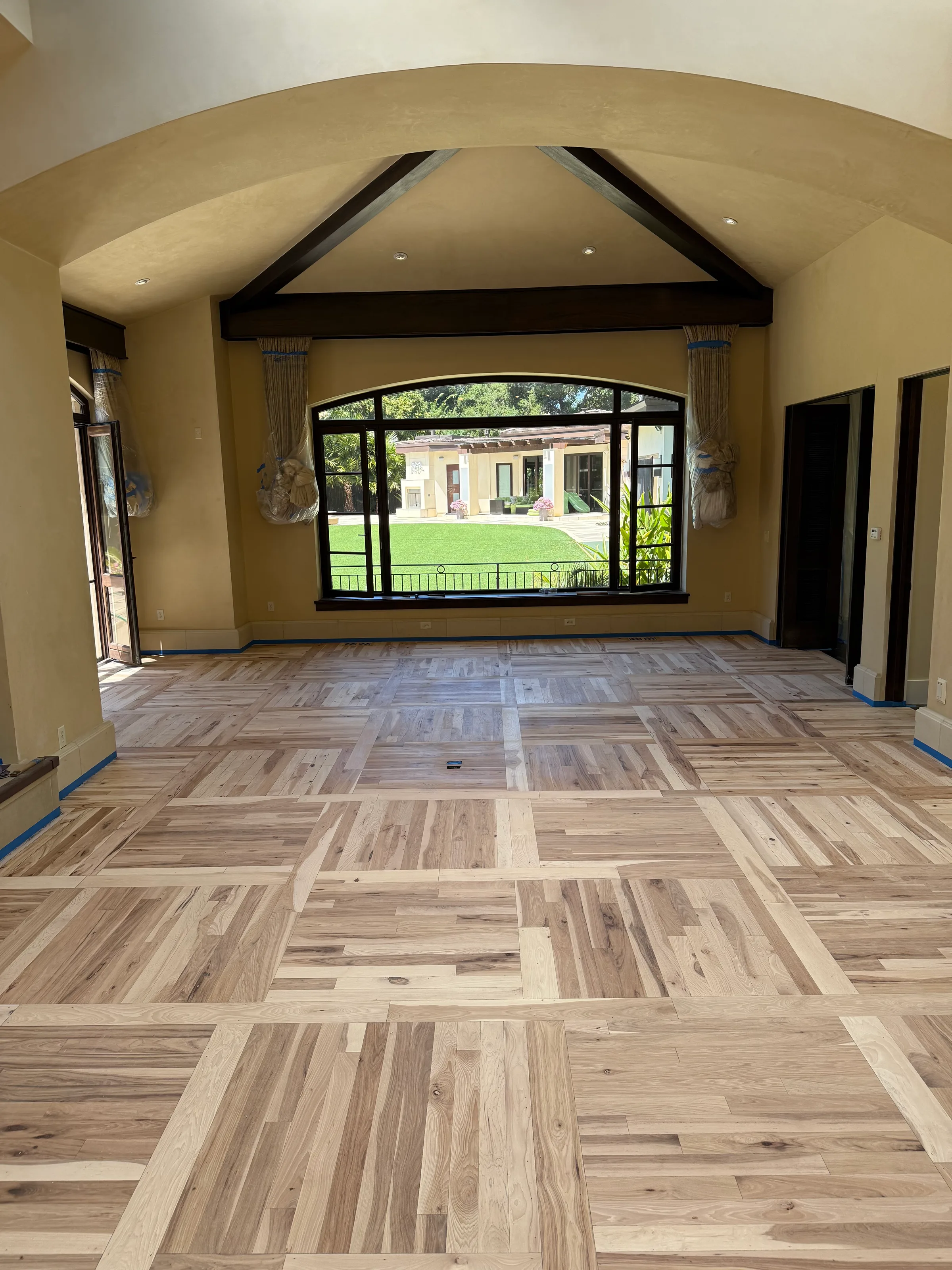 Hickory hardwood flooring in parquet geometric pattern showing varied grain and color in bright room