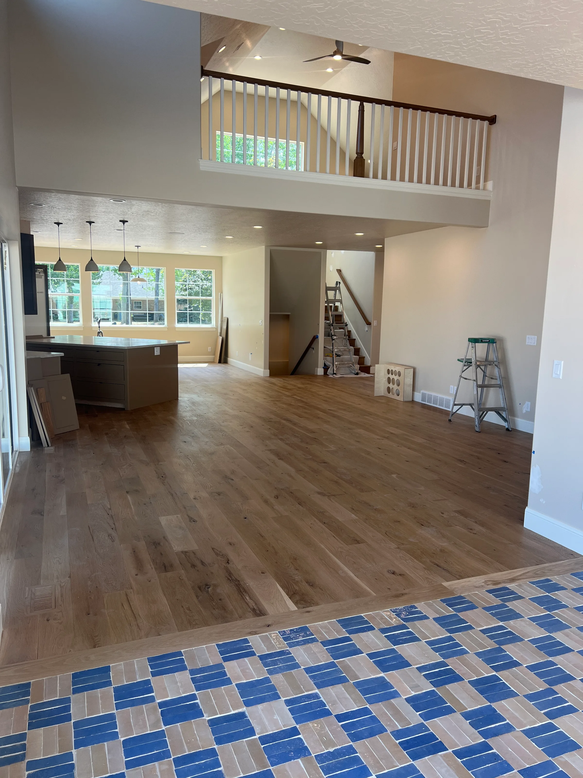 White oak hardwood flooring with natural character and subtle knot details in bright residential space