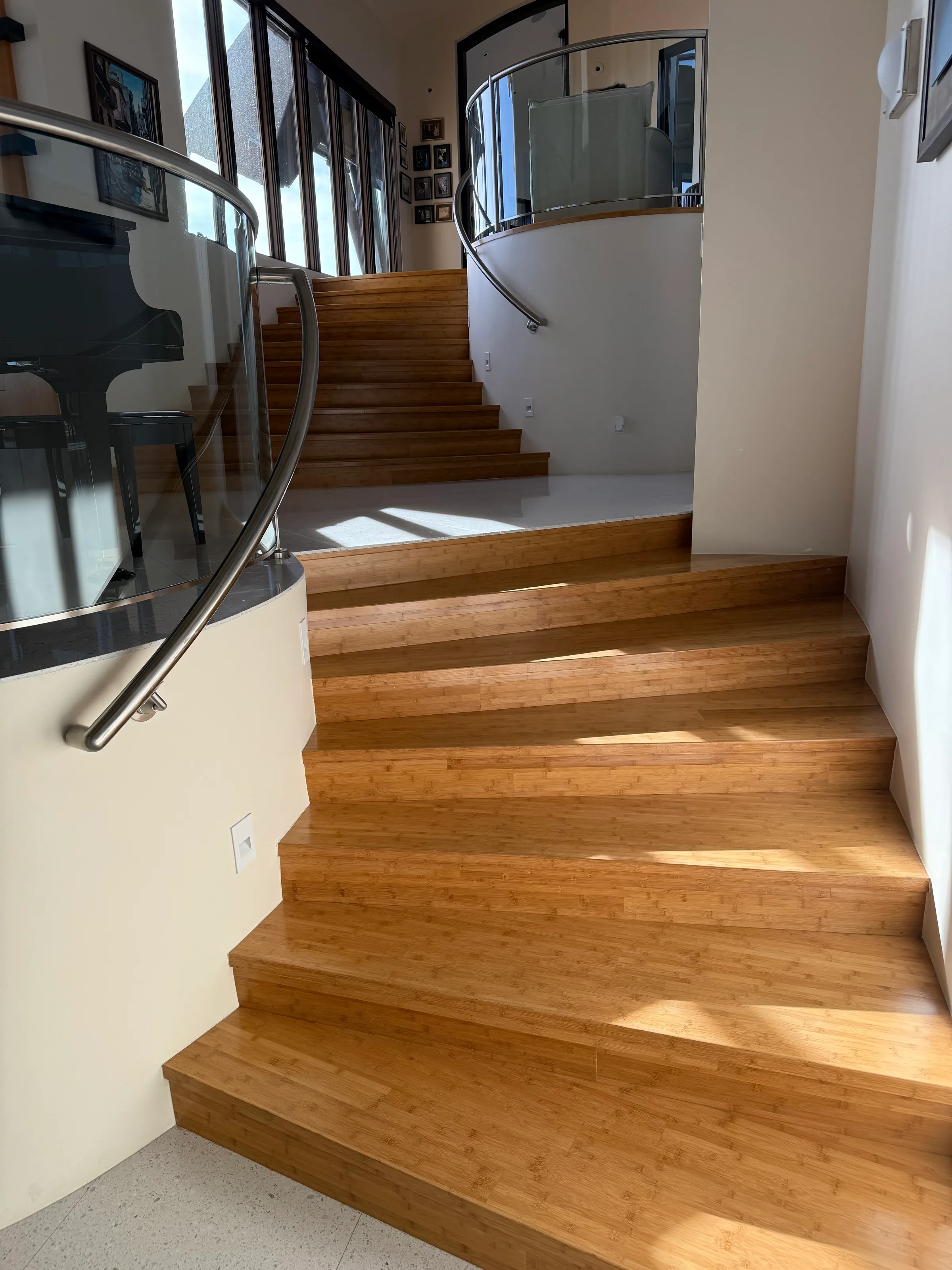 Bamboo staircase with squared tread profile showing linear grain structure in modern stairwell