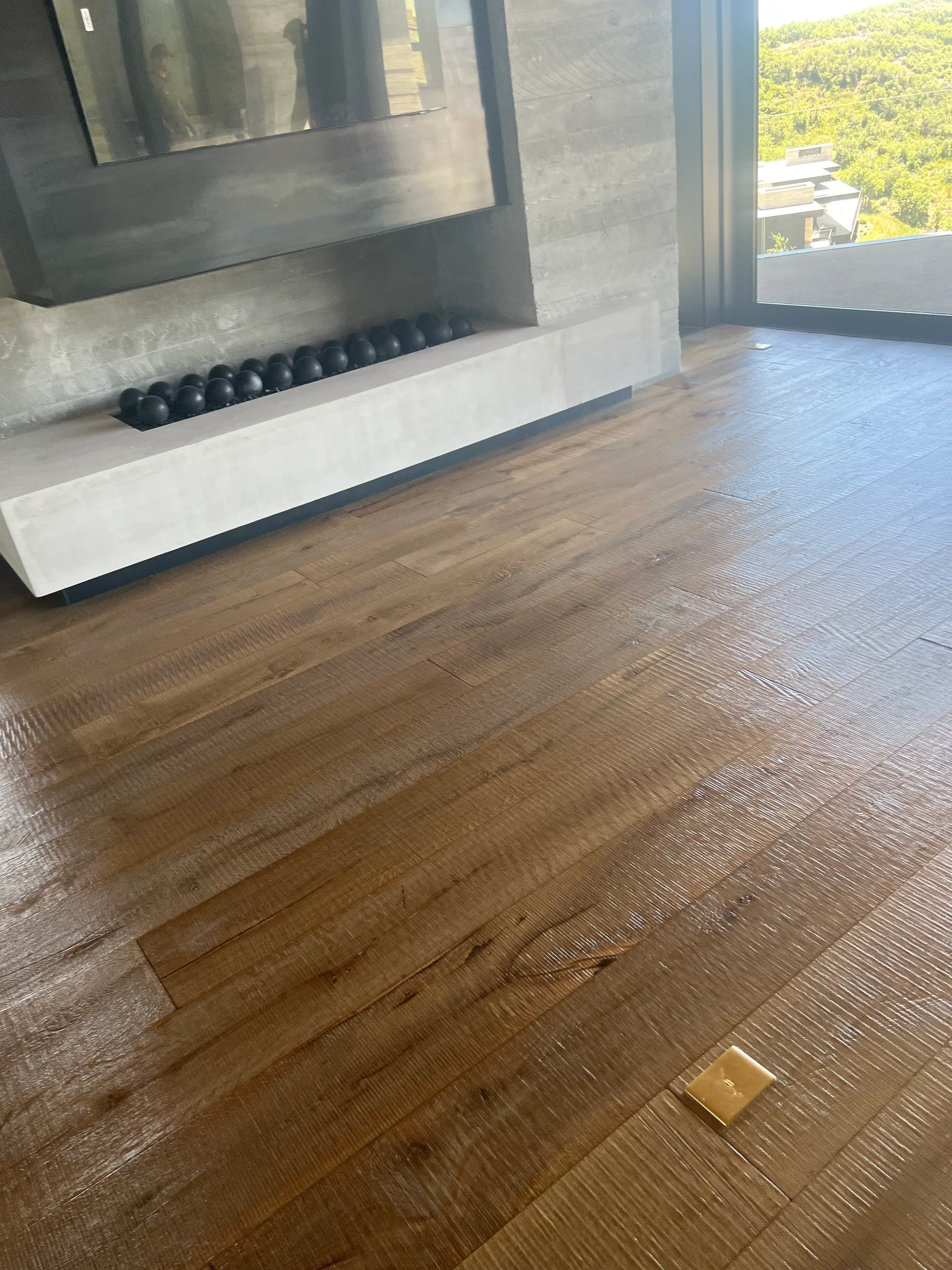 Pre-finished white oak hardwood flooring with factory protective finish in modern residential space