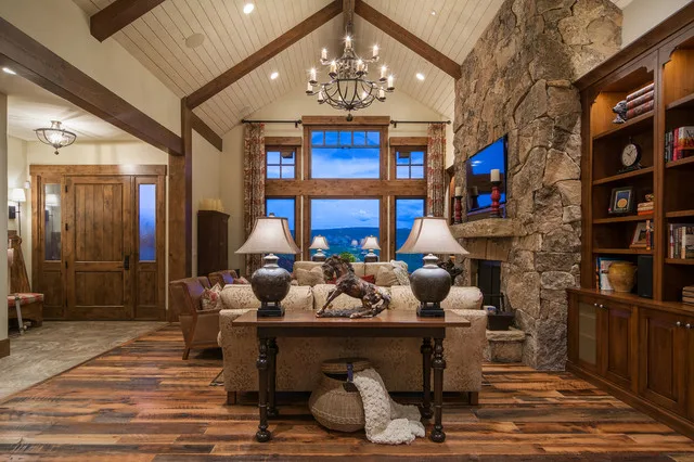 Reclaimed oak flooring with rich variation in color and grain in an elegant formal living area with fireplace